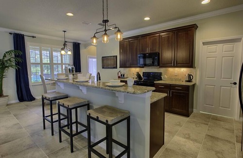 Kitchen with island and breakfast bar