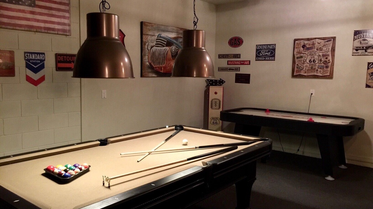 Games room with pool table and air hockey